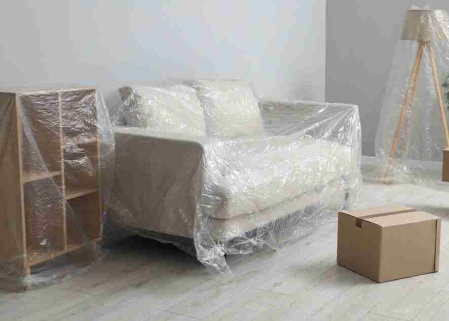 furniture wrapped with protective plastic